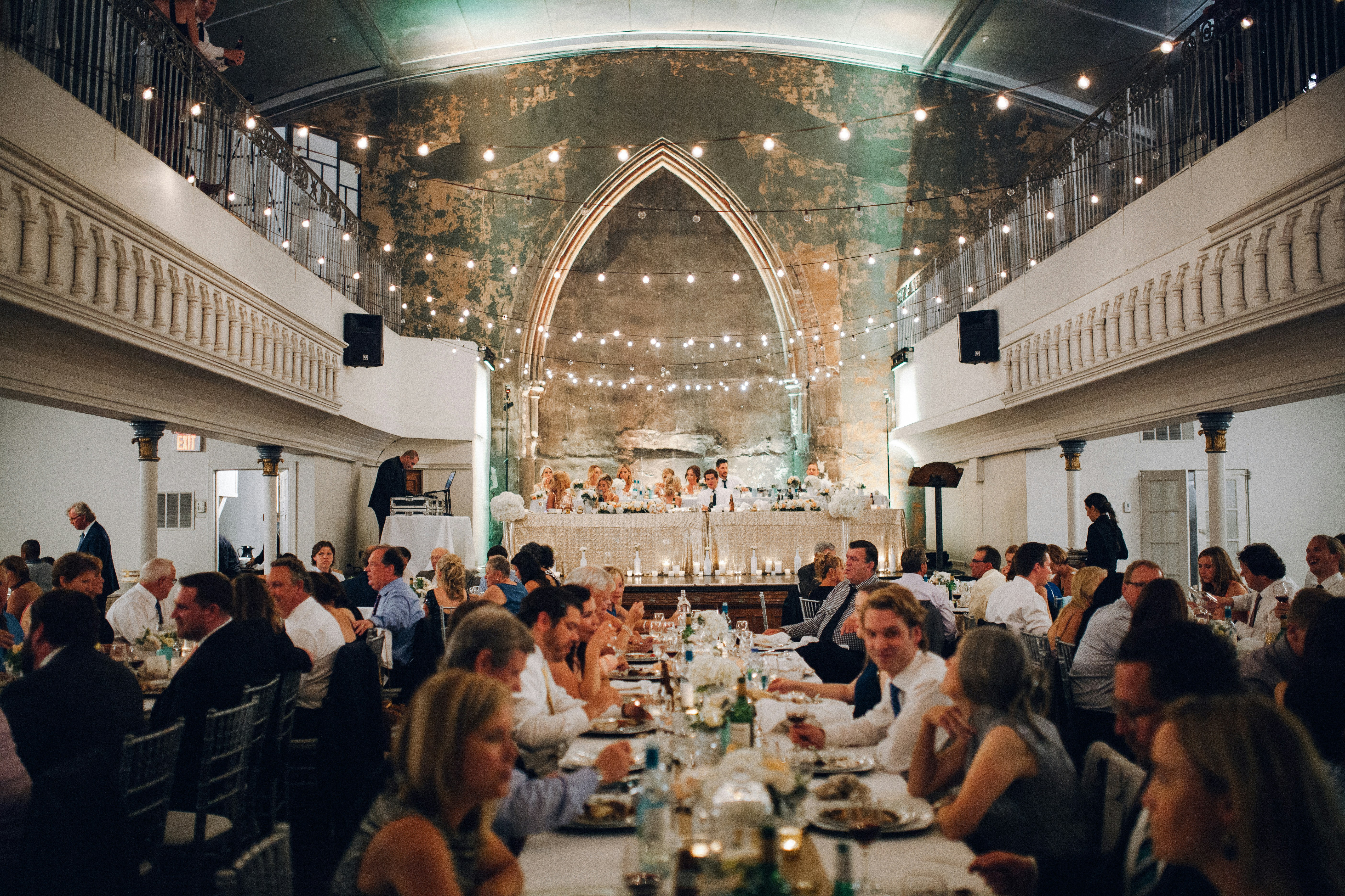 Wedding reception dinner with guests seated at tables